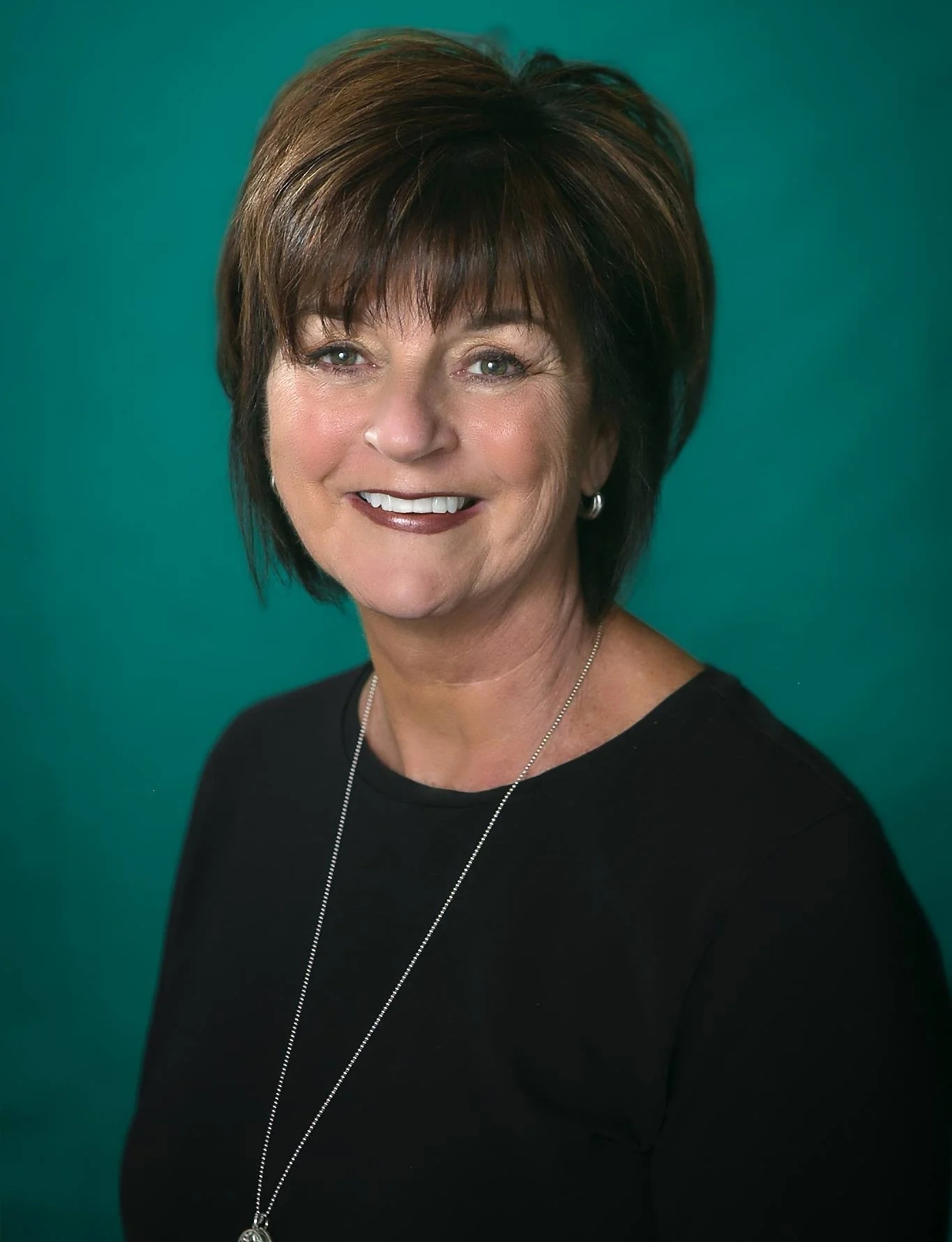 Deb Hooks, licensed Dubuque Iowa Realtor and Broker Associate with eXp Realty — professional headshot